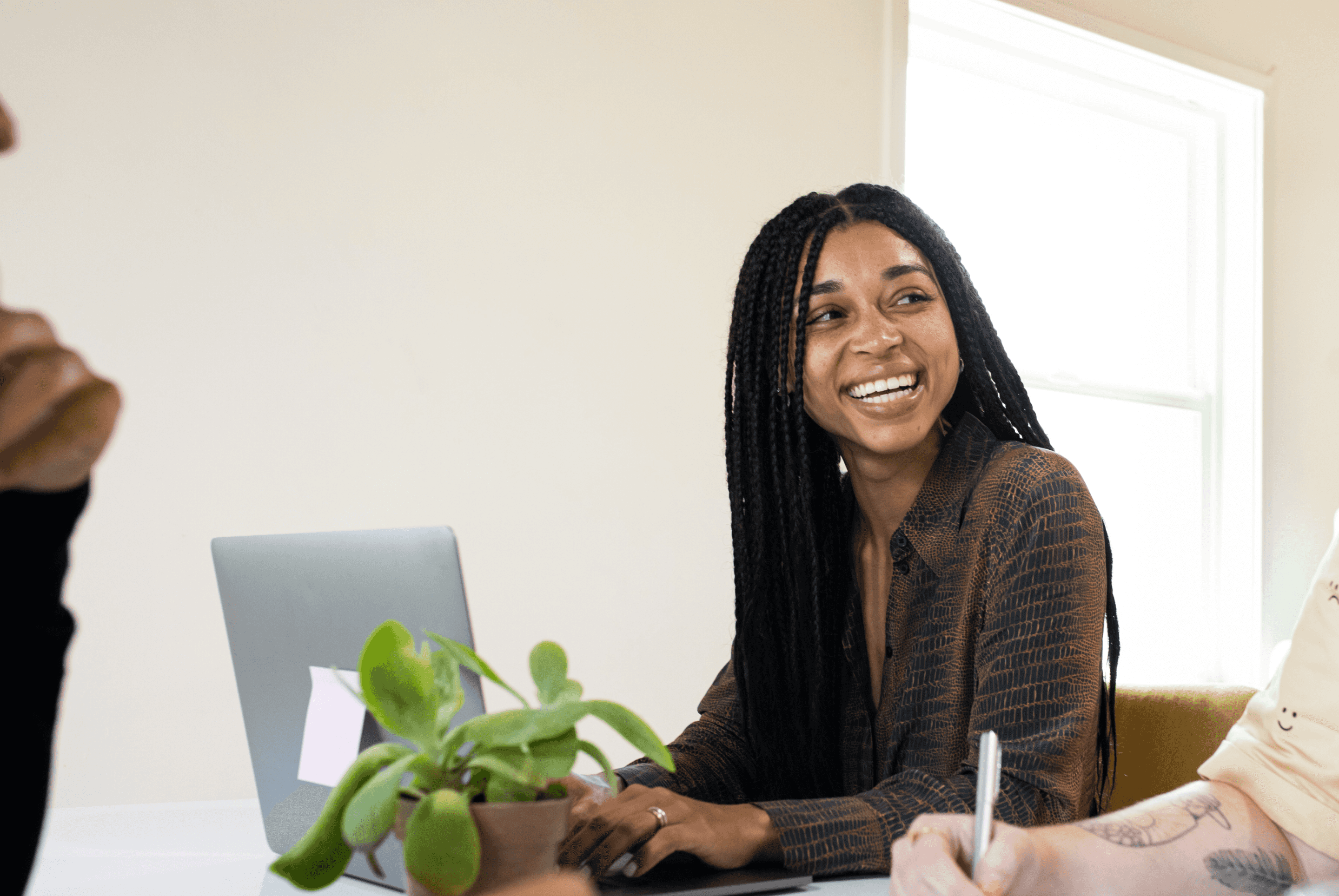 Happy woman on her computer reviewing medical bills