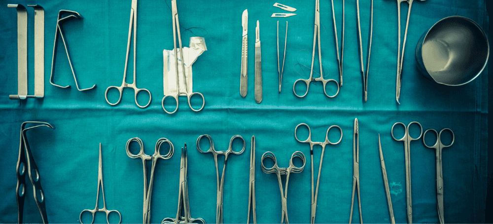 Medical tools used for an implant procedure laid out on a tablecloth